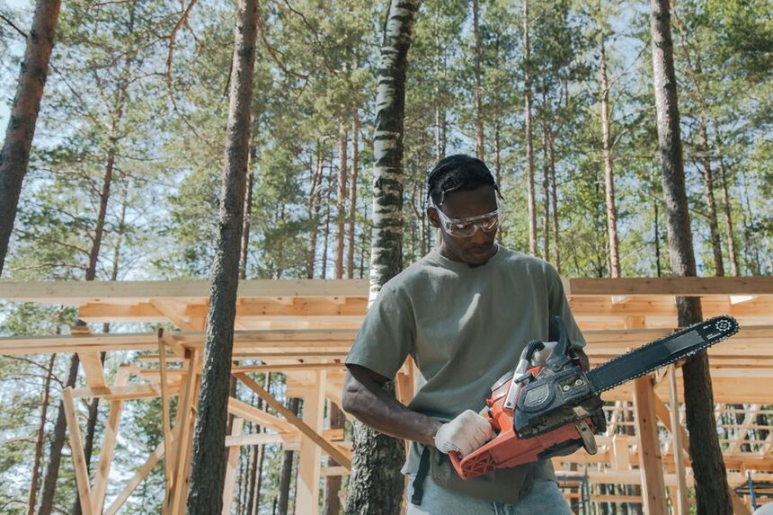 Tree professional operating a chainsaw on a removal job